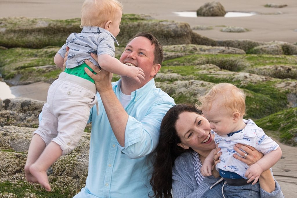 Happy Family during their photography experience, on the Oregon Coast