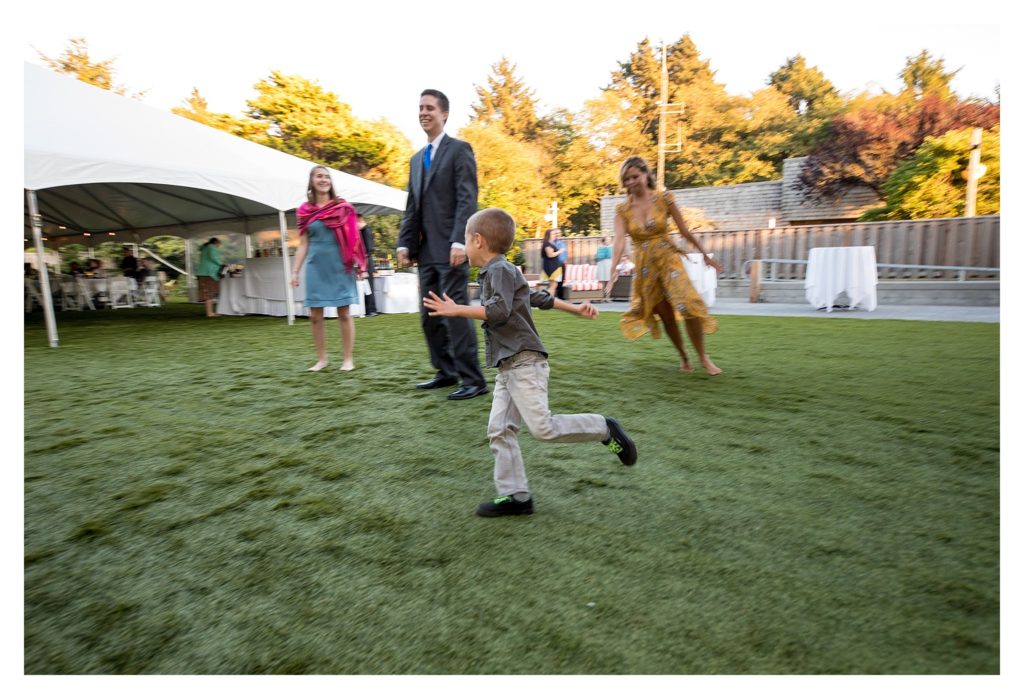 Little boy running at the Haystack gardens 