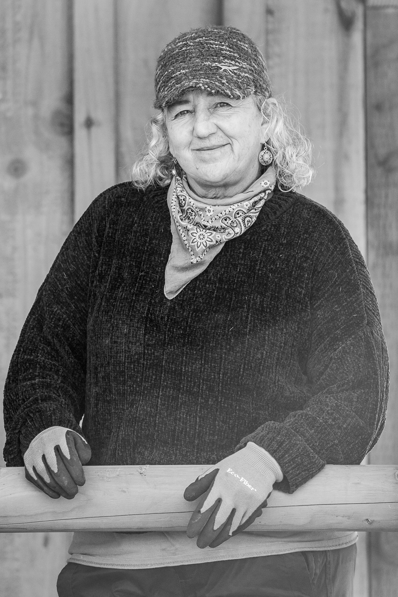 Renee owner of Hearts before the horse Stands at the stables of her horses. in Clatsop County Oregon.  Photo by Jody Rae Photography 